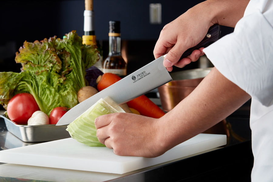 A photo of Gyuto knife being used.