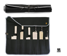 Load image into Gallery viewer, Sakai Ichimonji's black canvas knife roll (Kuro) with grey trim, shown open to display six Japanese knives and also in its rolled-up state.
