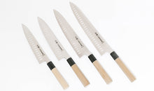Cargar imagen en el visor de la galería, Four Sakai Ichimonji Mitsuhide VG-10 Wagyuto chef knives with Granton edges (dimples) in different sizes.