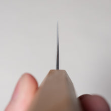 이미지를 갤러리 뷰어에로드, Close-up of a hand holding a hexagonal-shaped, wooden-handled double-edged Nakiri kitchen knife against a white background. This knife is the Sakai Ichimonji Mitsuhide Silver Steel #3 Tai Nakiri
