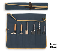 將圖像加載到圖庫查看器中， An iron-blue canvas roll holding a collection of Japanese knives.
